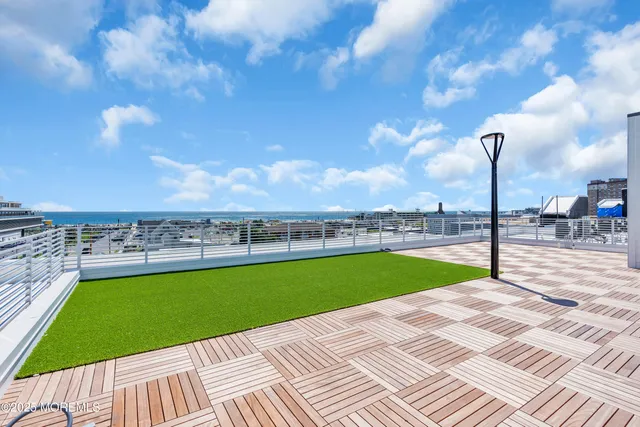 a view of a swimming pool and a yard