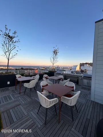 a view of a big yard with table and chairs