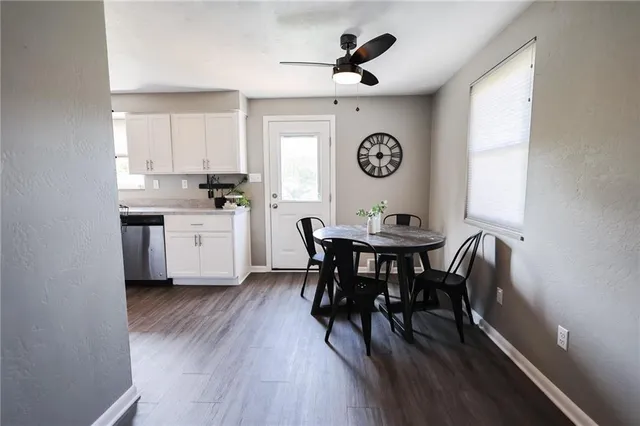 a view of a dining room with furniture and window