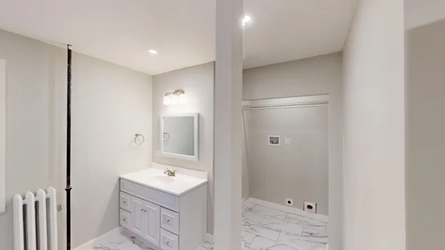 a bathroom with a white bath tub
