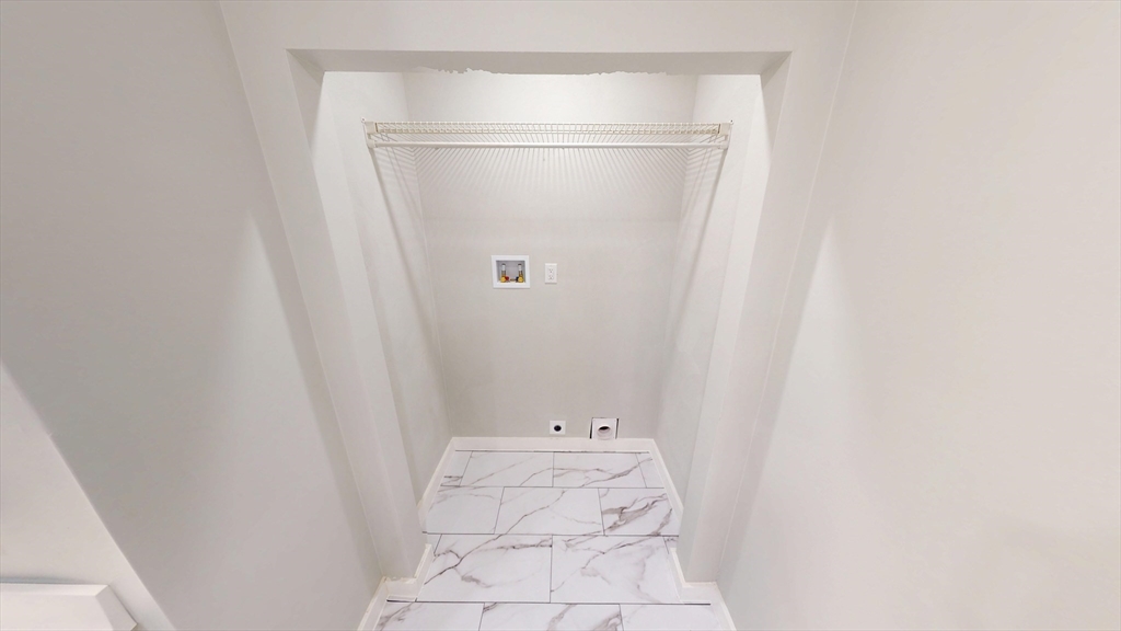 168 Oak Street, Unit 1 Gardner, MA 01440 - Photo 14 of 23 a bathroom with a white bath tub