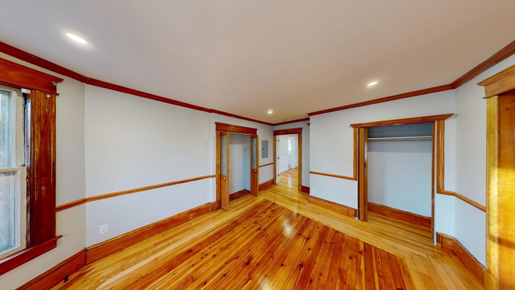 168 Oak Street, Unit 1 Gardner, MA 01440 - Photo 20 of 23 a view of an empty room with wooden floor