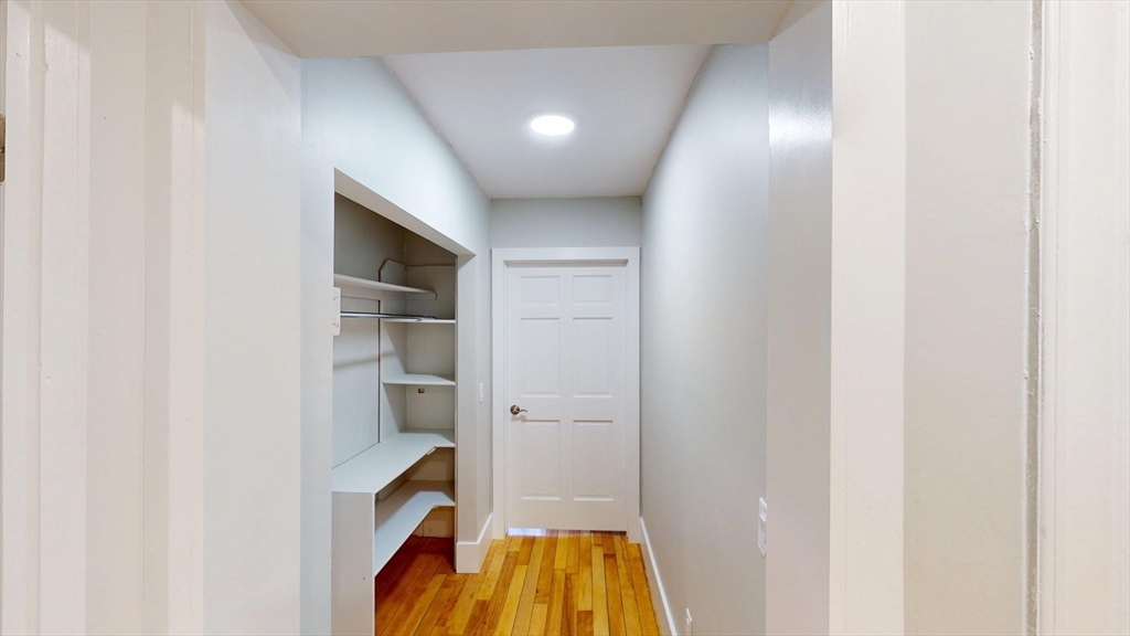168 Oak Street, Unit 1 Gardner, MA 01440 - Photo 21 of 23 a view of an empty room with cabinet and entryway