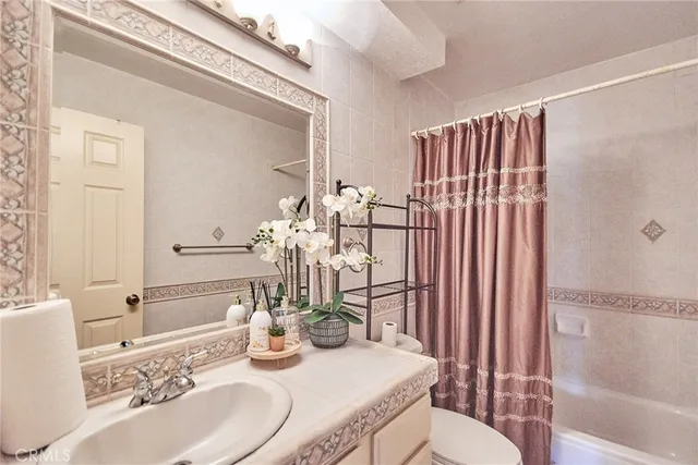 a room with a wooden floor and white walls