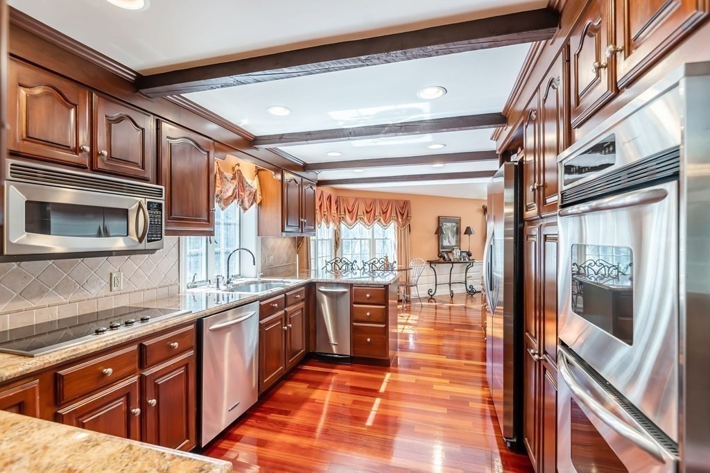 83 Valley Road Boxford, MA 01921 - Photo 11 of 31 a large kitchen with stainless steel appliances granite countertop a lot of counter space and a sink