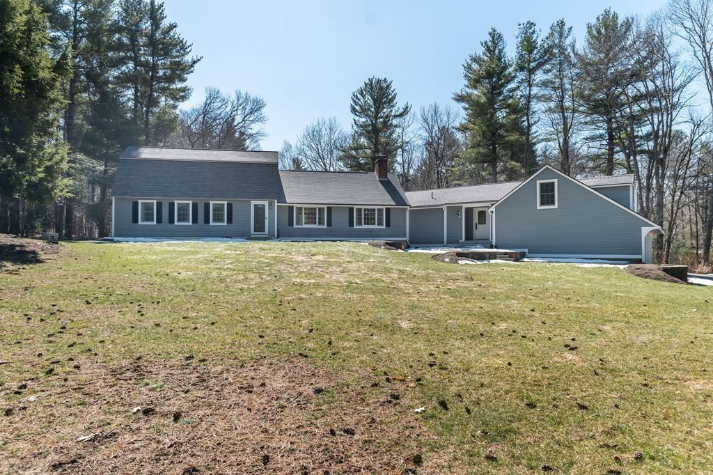 83 Valley Road Boxford, MA 01921 - Photo 2 of 31 a house that has a big yard with large trees