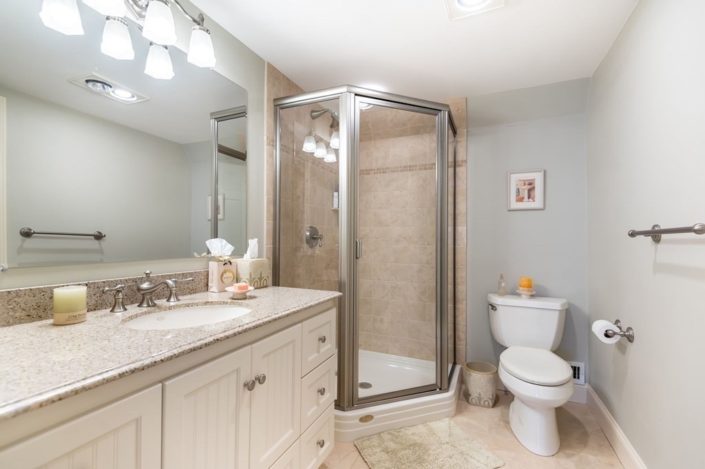 83 Valley Road Boxford, MA 01921 - Photo 25 of 31 a bathroom with a granite countertop sink toilet and shower