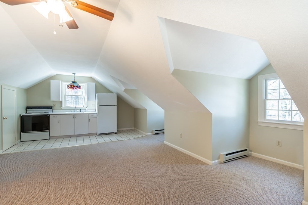 83 Valley Road Boxford, MA 01921 - Photo 26 of 31 an empty room with windows and entrance