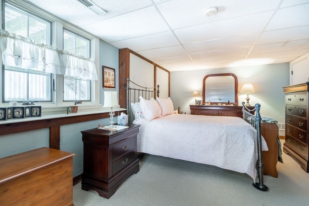 83 Valley Road Boxford, MA 01921 - Photo 28 of 31 a bedroom with a bed and a large window