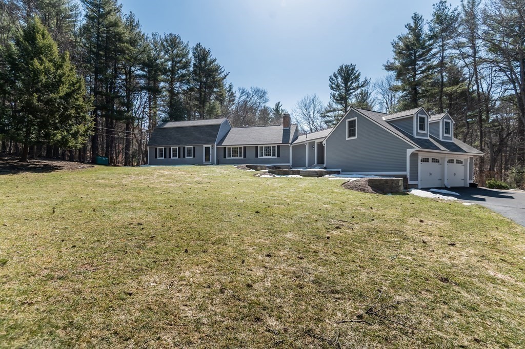 83 Valley Road Boxford, MA 01921 - Photo 3 of 31 a house with a yard