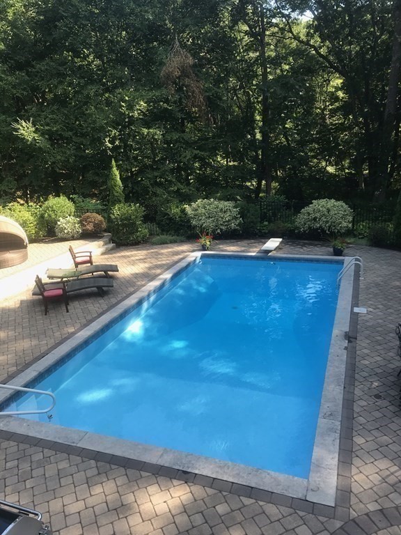 83 Valley Road Boxford, MA 01921 - Photo 31 of 31 a view of a swimming pool with an outdoor seating