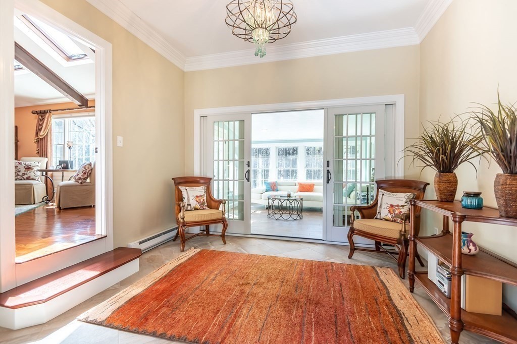 83 Valley Road Boxford, MA 01921 - Photo 7 of 31 a living room with furniture and a floor to ceiling window