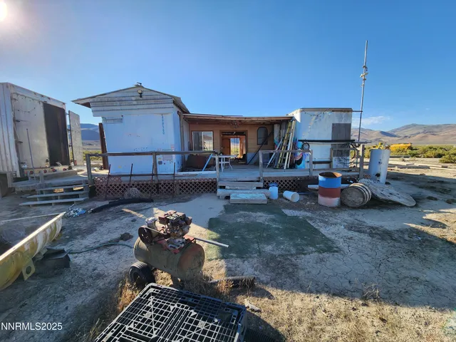 a view of a backyard of the house