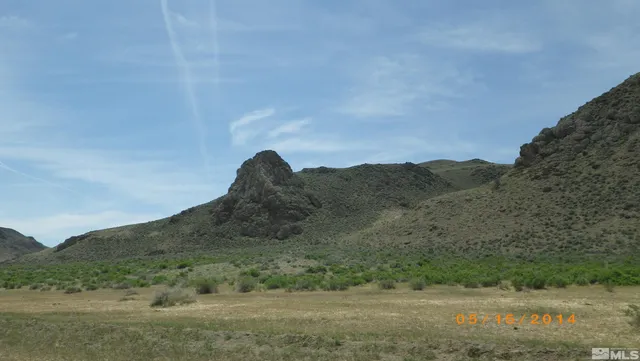 a view of a lake with a mountain in the background