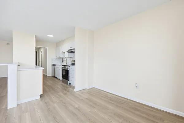a view of kitchen with wooden floor