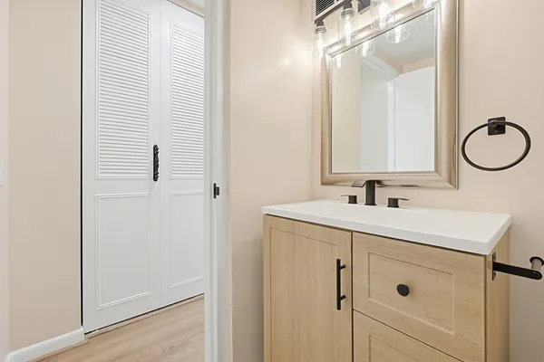 a bathroom with a sink and a mirror