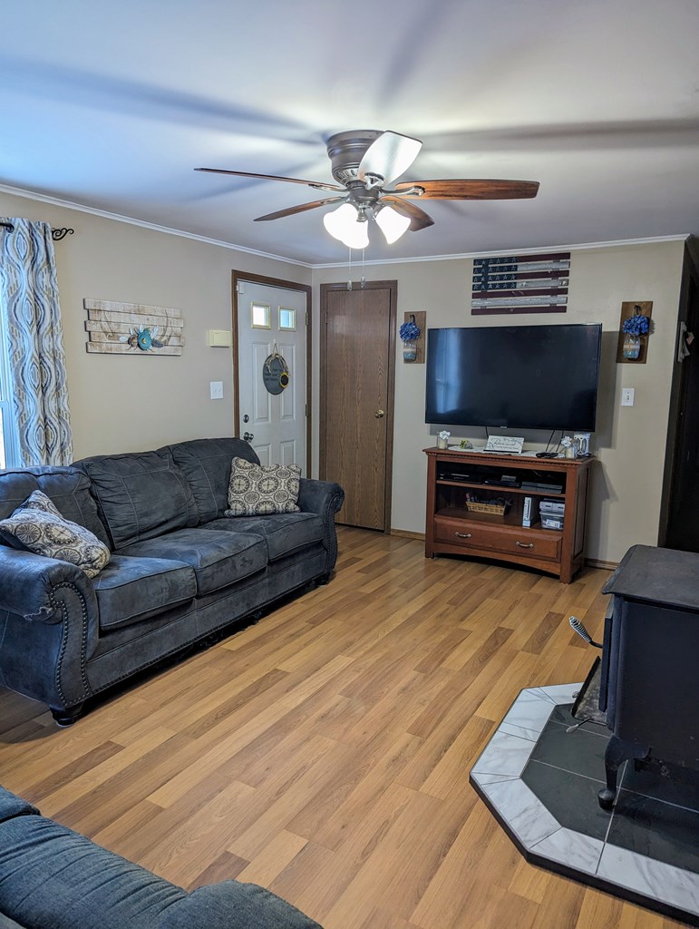 1406 Valley Road Polk, PA 16342 - Photo 12 of 31 a living room with furniture and a flat screen tv