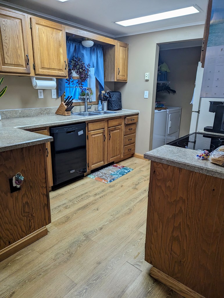 1406 Valley Road Polk, PA 16342 - Photo 16 of 31 a kitchen with stainless steel appliances granite countertop a sink stove and cabinets