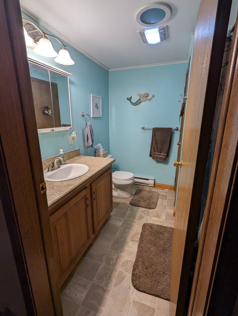 1406 Valley Road Polk, PA 16342 - Photo 29 of 31 a bathroom with a sink and a mirror