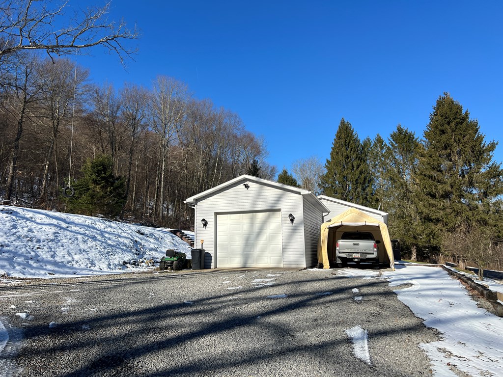 1406 Valley Road Polk, PA 16342 - Photo 9 of 31 a front view of a house with a yard