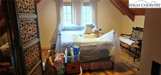 a room with water heater and a shower