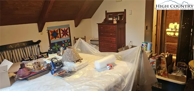 a bedroom with furniture and a bed