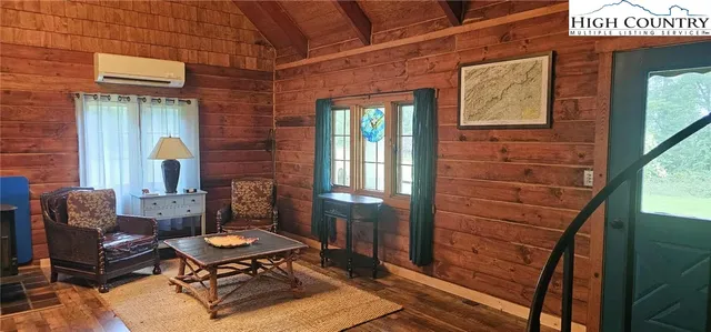 a balcony with table and chairs