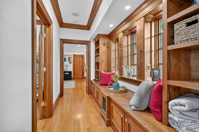 a very nice looking room with a large window and furniture