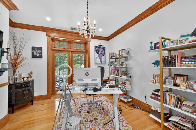 a living room with furniture and a book shelf