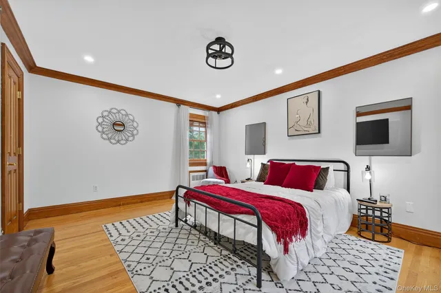 a bedroom with a bed and a table in it