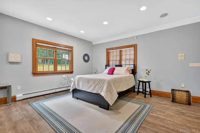 a bed room with a bed and a window