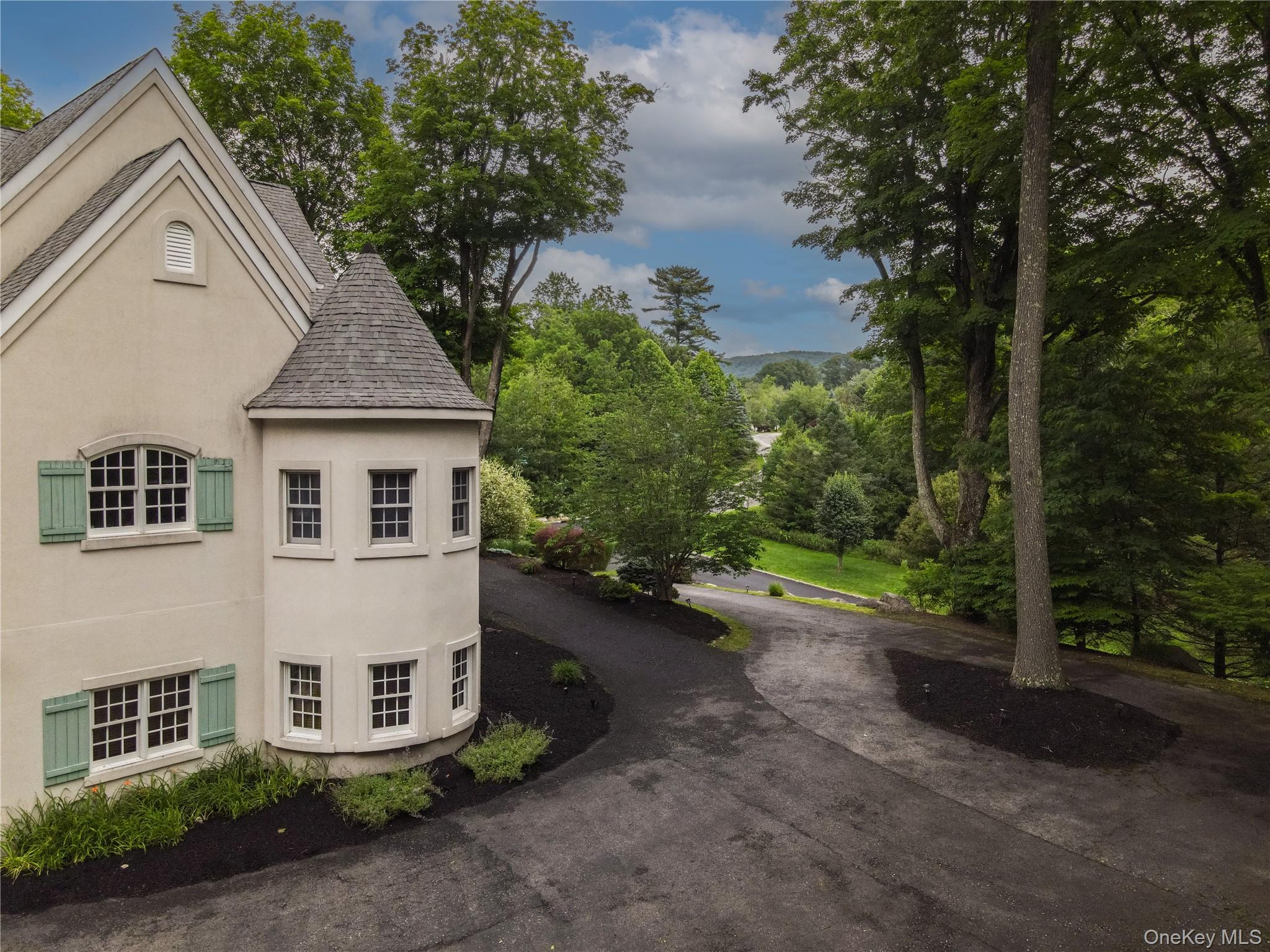 10 Greenwich Avenue Central Valley, NY 10917 - Photo 40 of 42 a view of a white house next to a yard and a road