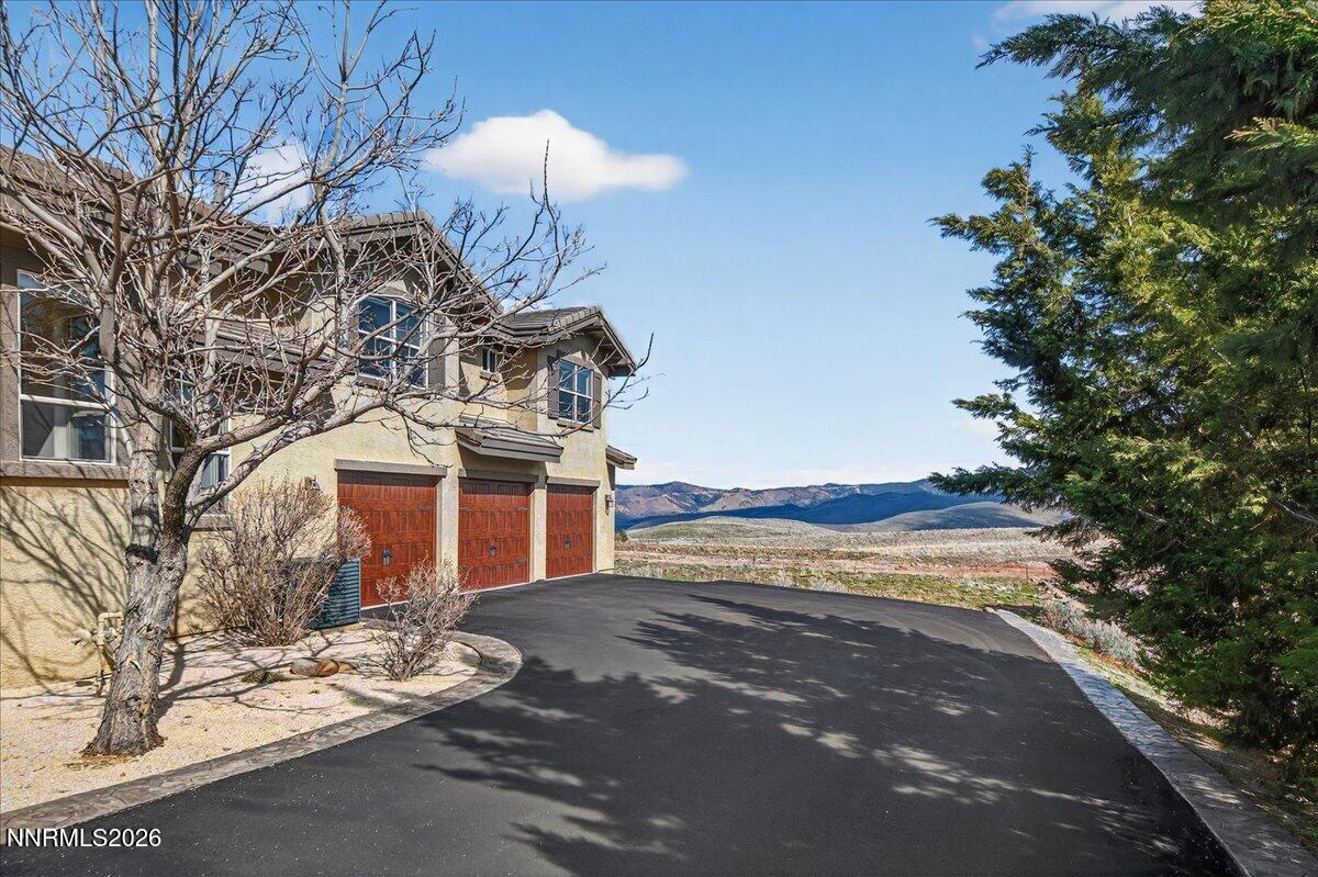 224 South Earlham Court Reno, NV 89511 - Photo 14 of 54 a front view of a house with a yard