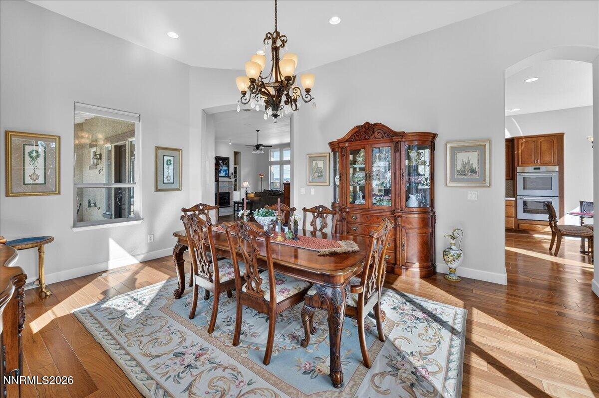 224 South Earlham Court Reno, NV 89511 - Photo 44 of 54 a view of a dining room with furniture wooden floor and chandelier