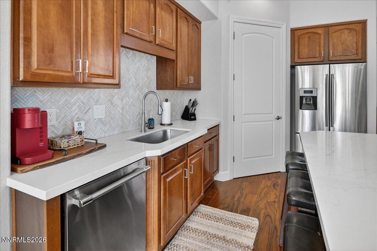 224 South Earlham Court Reno, NV 89511 - Photo 45 of 54 a kitchen with stainless steel appliances granite countertop a sink stove and refrigerator