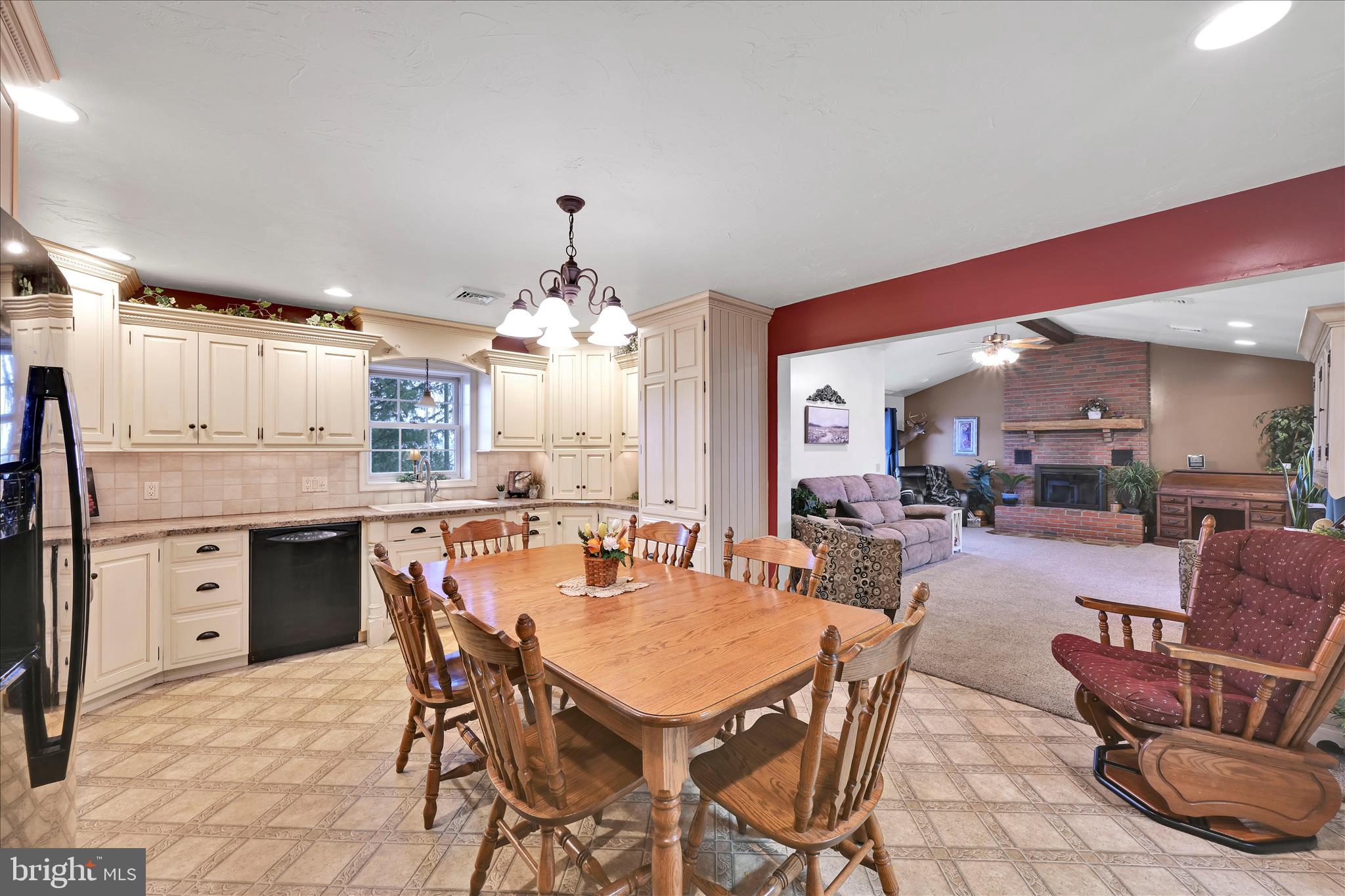 61 West Rosebud Road Myerstown, PA 17067 - Photo 18 of 58 a dining table with chairs and kitchen view
