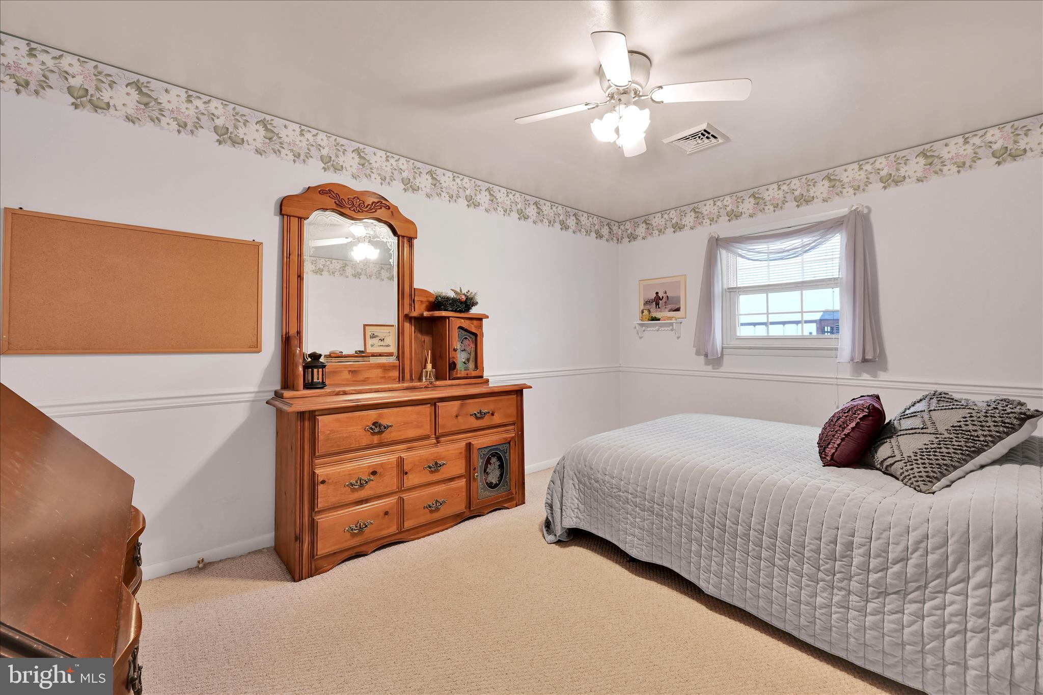 61 West Rosebud Road Myerstown, PA 17067 - Photo 28 of 58 a bedroom with a bed and a chandelier