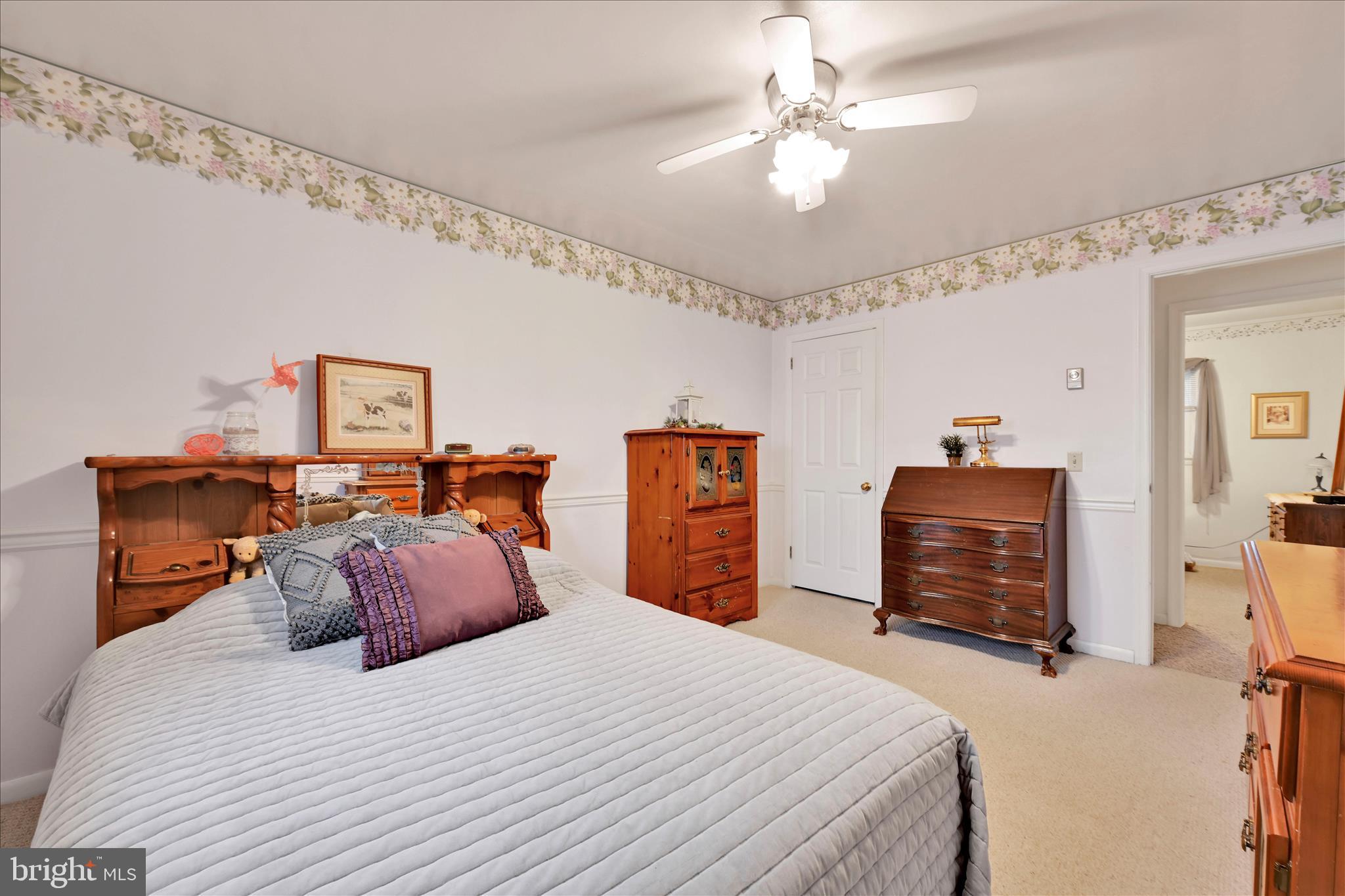 61 West Rosebud Road Myerstown, PA 17067 - Photo 29 of 58 a bedroom with a bed and a chandelier