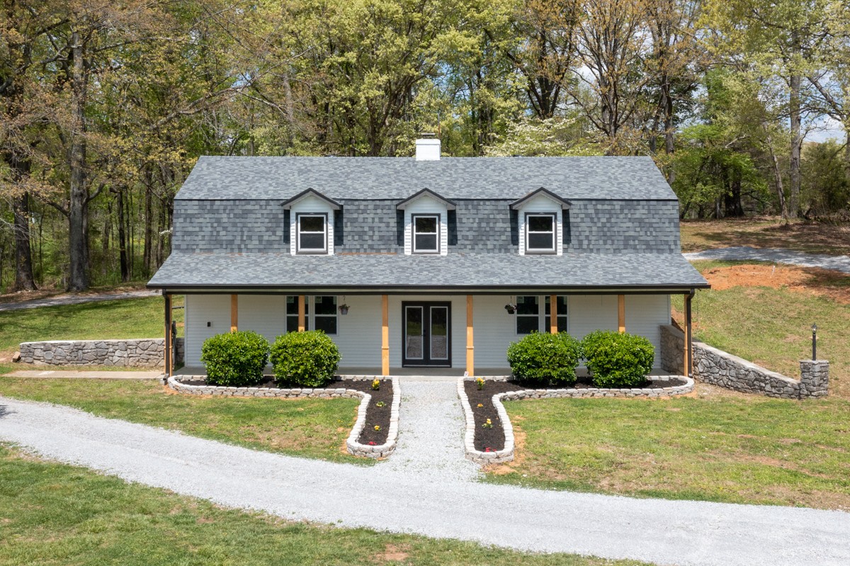 401 S Road Cottontown, TN 37048 - Photo 2 of 50 a front view of a house with a yard