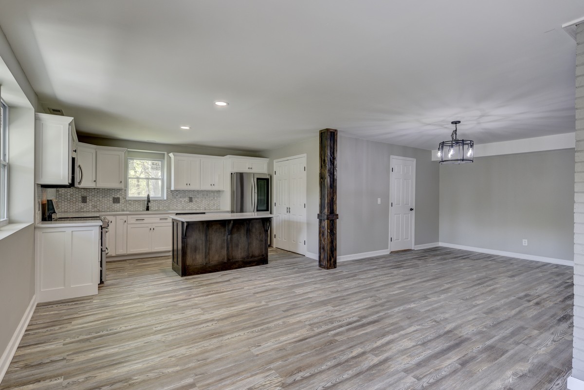 401 S Road Cottontown, TN 37048 - Photo 16 of 50 a view of kitchen with cabinets and wooden floor
