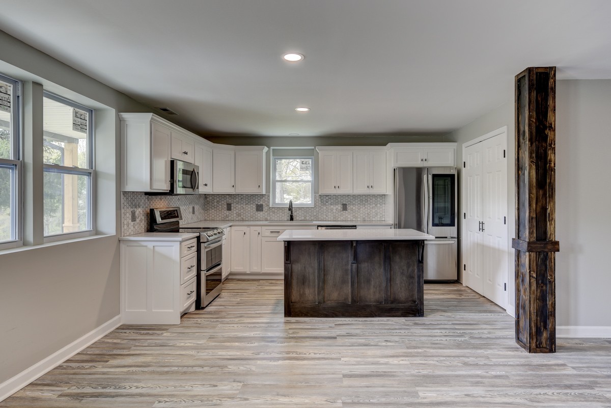 401 S Road Cottontown, TN 37048 - Photo 17 of 50 a kitchen with a refrigerator and a stove top oven