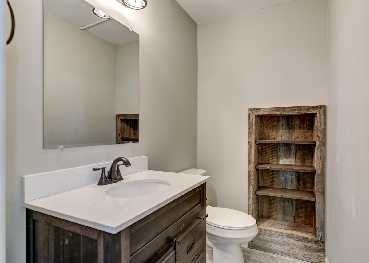 401 S Road Cottontown, TN 37048 - Photo 28 of 50 a bathroom with a sink toilet and a mirror
