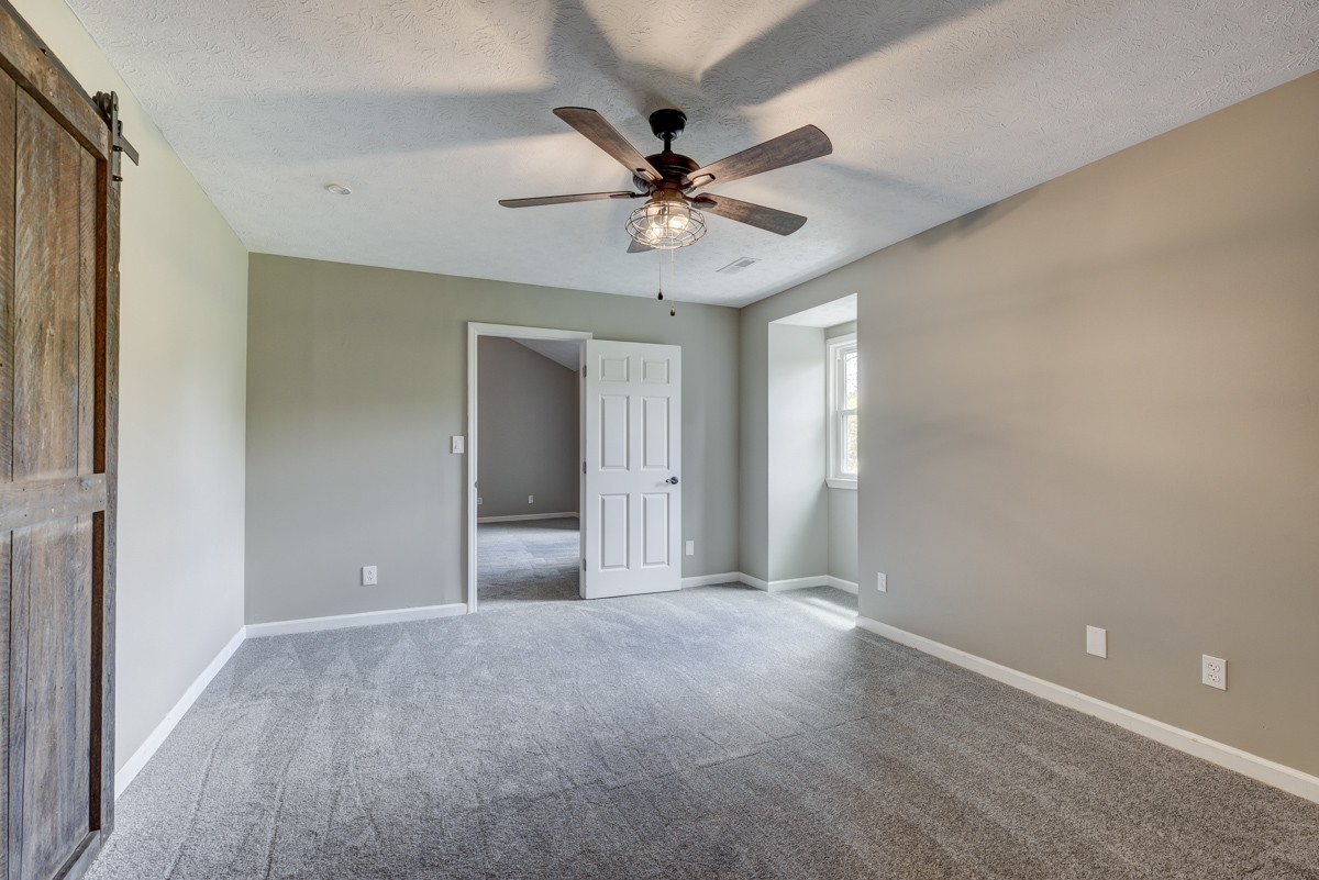 401 S Road Cottontown, TN 37048 - Photo 33 of 50 a view of a livingroom with a ceiling fan and window