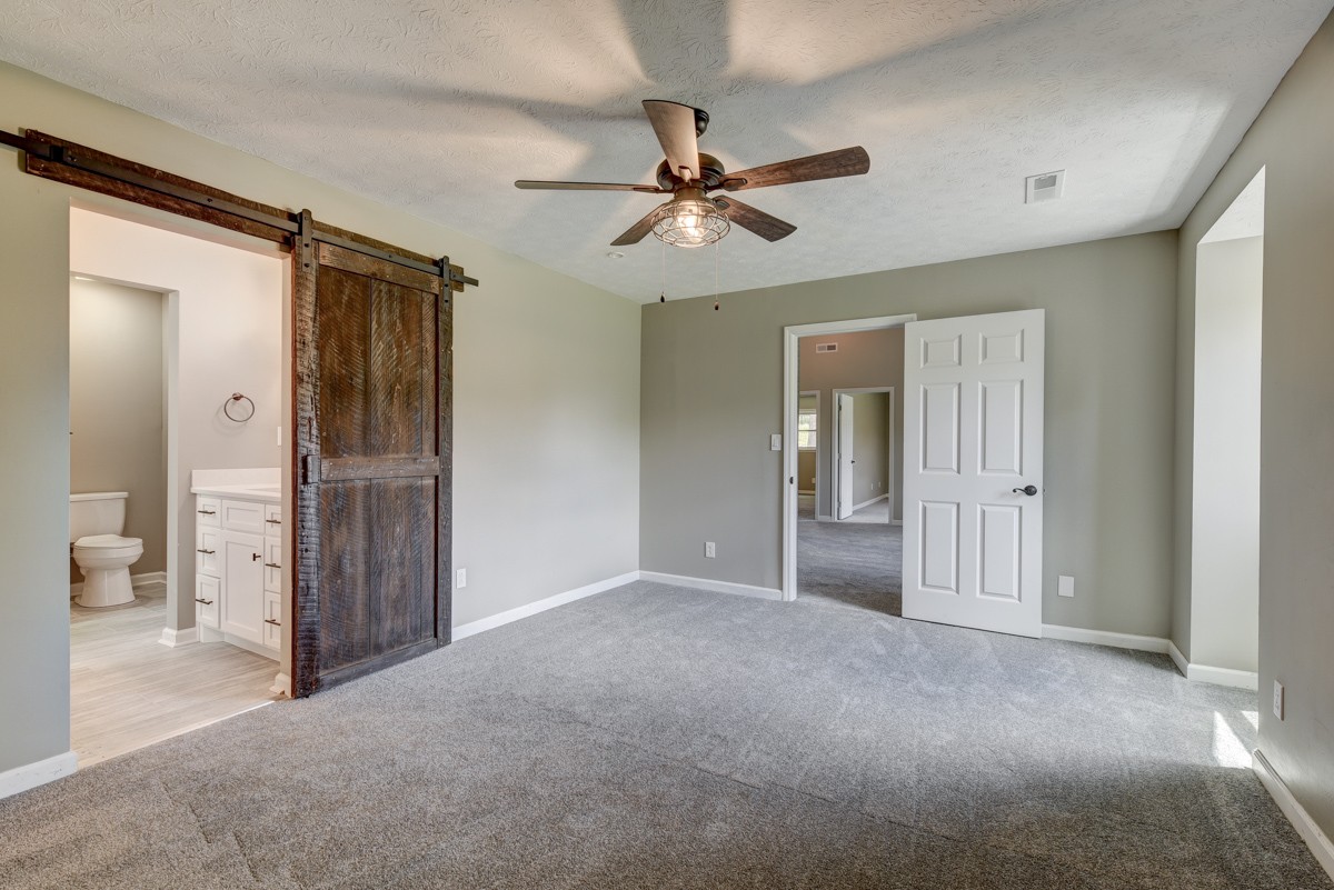 401 S Road Cottontown, TN 37048 - Photo 34 of 50 a view of a hallway with a chandelier fan