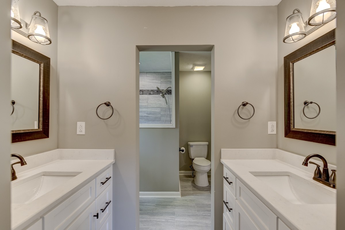 401 S Road Cottontown, TN 37048 - Photo 35 of 50 a bathroom with a sink a toilet and a mirror