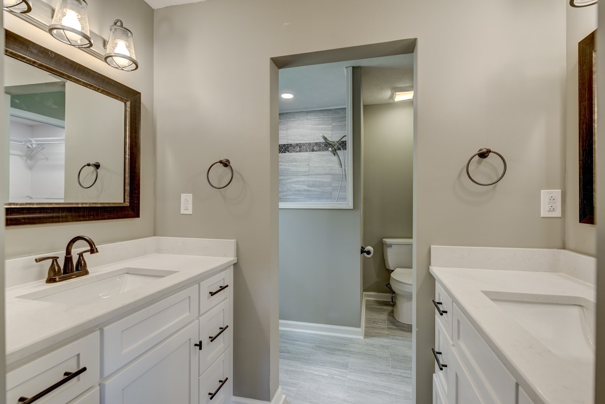 401 S Road Cottontown, TN 37048 - Photo 36 of 50 a bathroom with a sink a toilet and shower