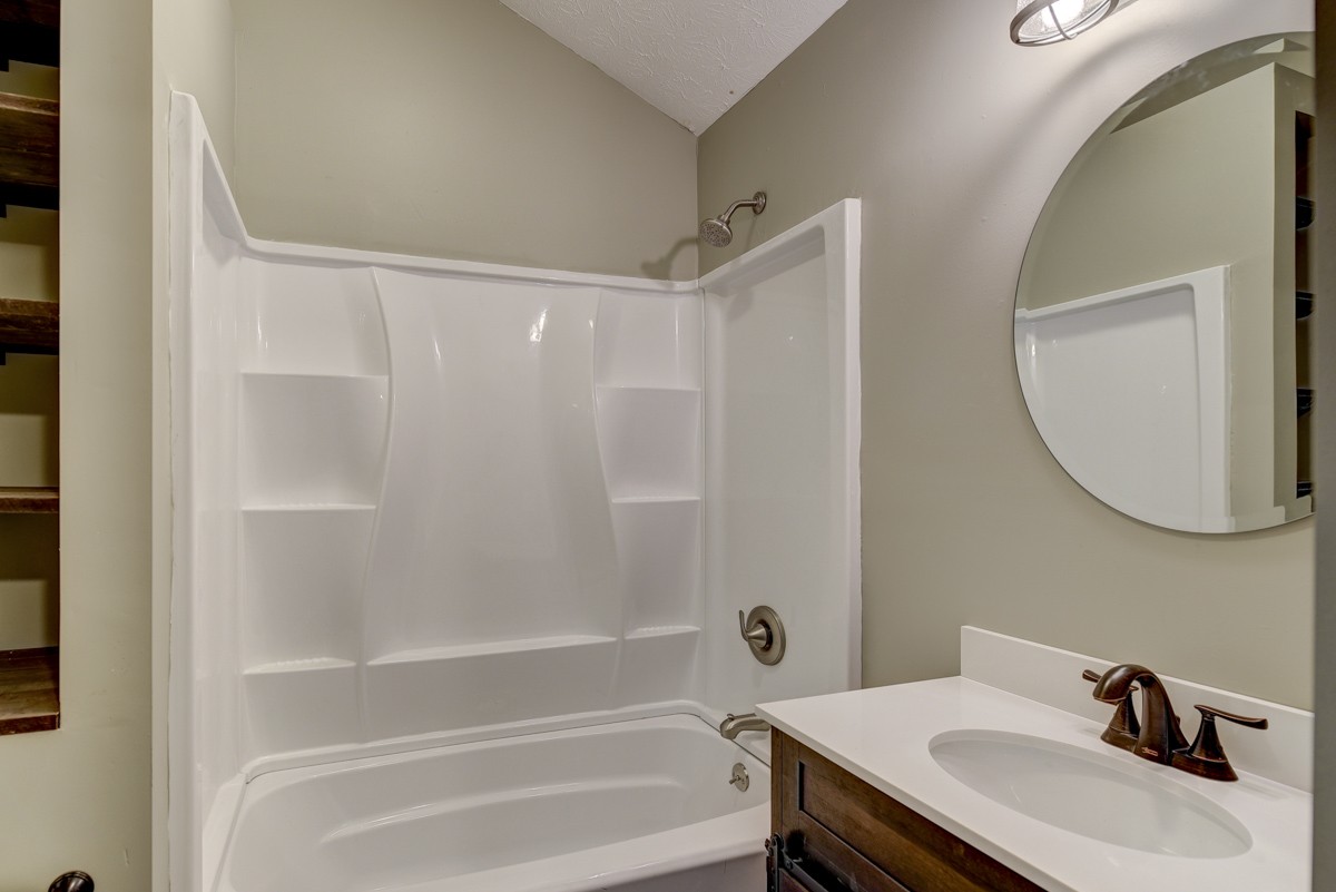 401 S Road Cottontown, TN 37048 - Photo 42 of 50 a bathroom with a sink vanity and a mirror