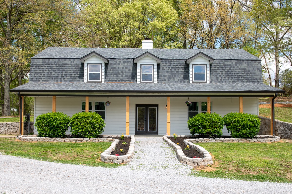 401 S Road Cottontown, TN 37048 - Photo 9 of 50 a front view of a house with garden