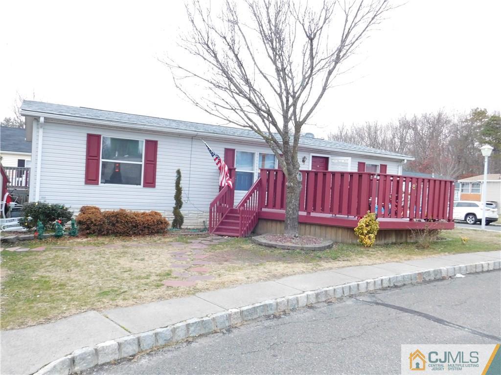 8 Ruffian Way, Unit 8 Howell, NJ 07731 - Photo 2 of 12 a view of a house with a yard and sitting area