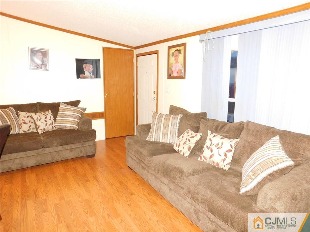 8 Ruffian Way, Unit 8 Howell, NJ 07731 - Photo 5 of 12 a bedroom with a bed and couch